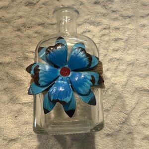 Decorative Glass Bottle with Blue Flower Accent
